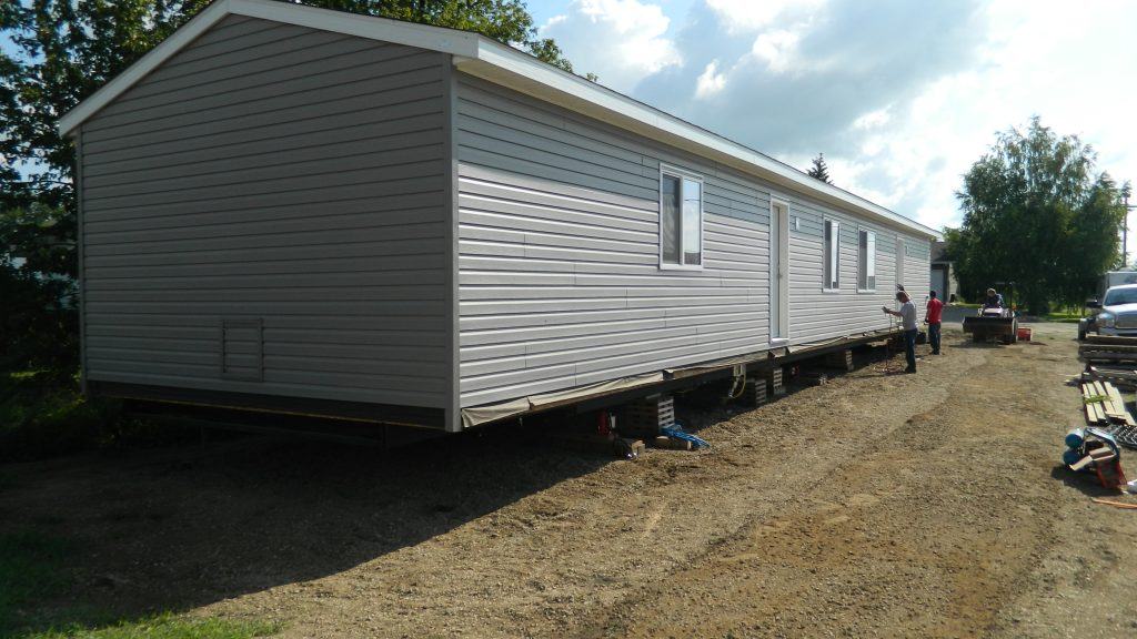 A modular home set and levelled on screw piles